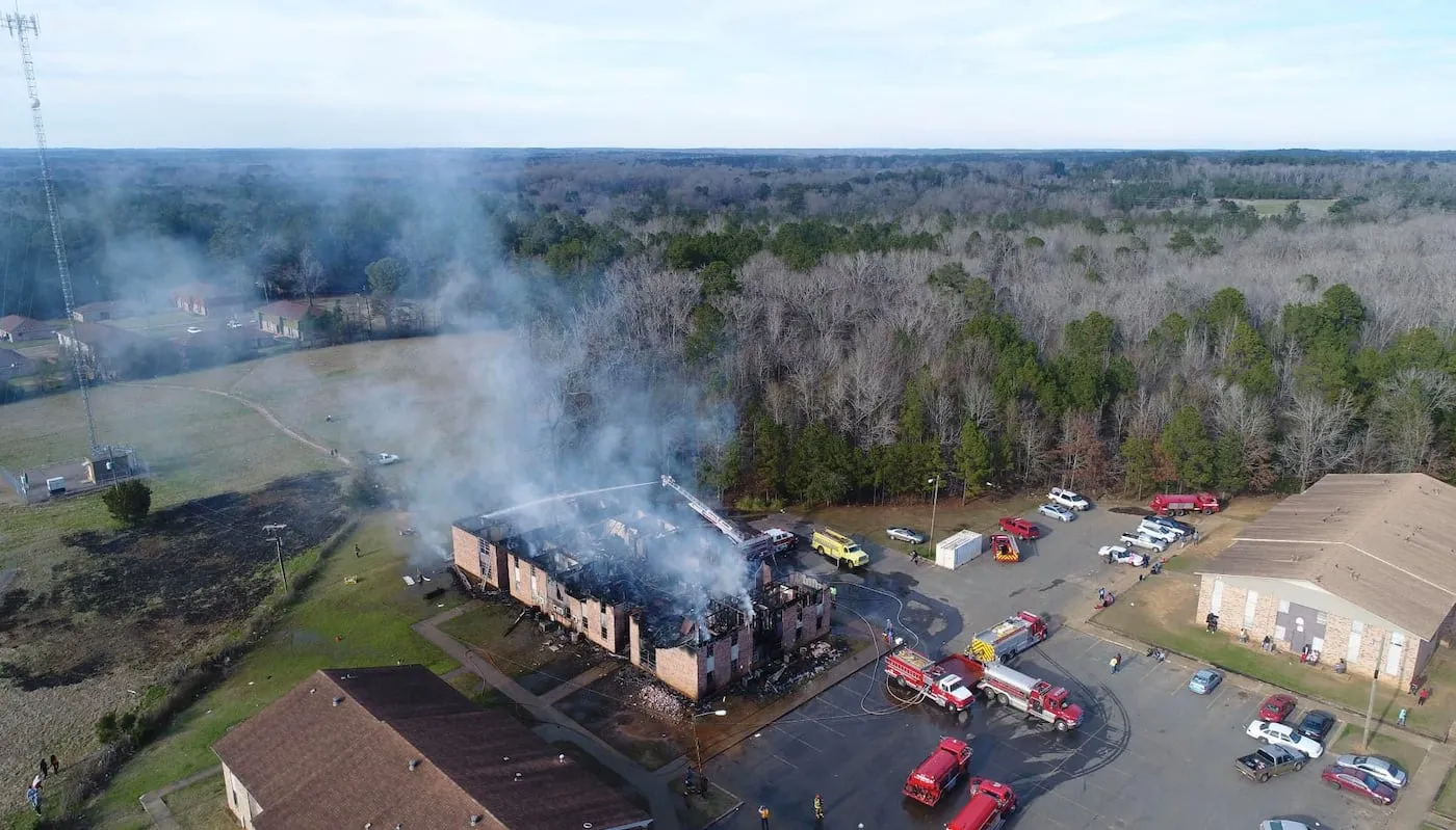Smoke from the afternoon blaze Jan. 12 that destroyed Building C at Apollo Plaza Apartments in Many could be seen for miles.